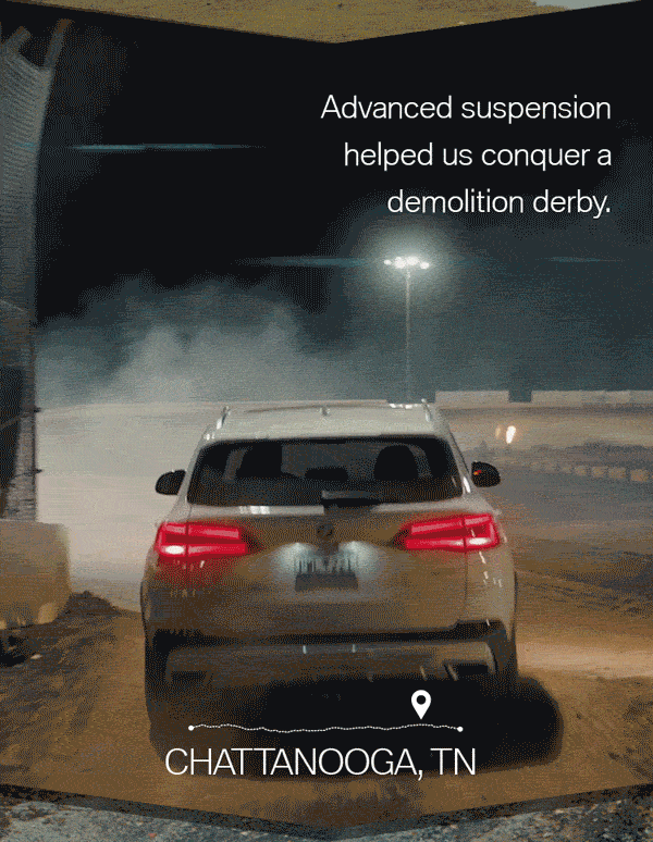 White BMW SUV driving through a dirt track flying by other cars participating in a demolition derby, with taglines "Advanced suspension helped us conquer a demolition derby" and "Chattanooga, TN" at the bottom.