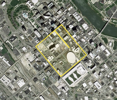A satellite view of a city with a yellow outline around a certain city block.